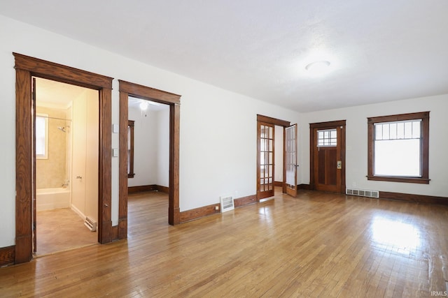 interior space featuring light hardwood / wood-style flooring and french doors