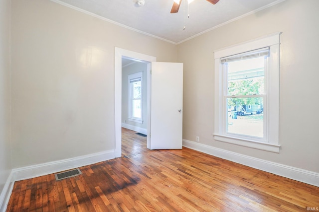 unfurnished room with crown molding, ceiling fan, and hardwood / wood-style floors