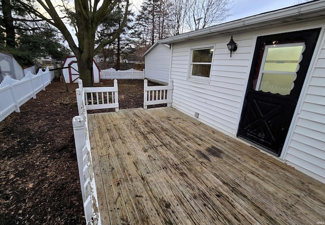 deck with a storage shed