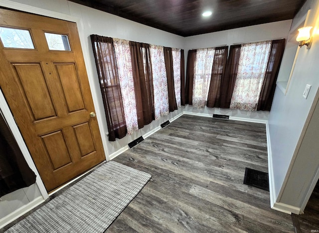 entryway with wooden ceiling, dark hardwood / wood-style floors, and a healthy amount of sunlight