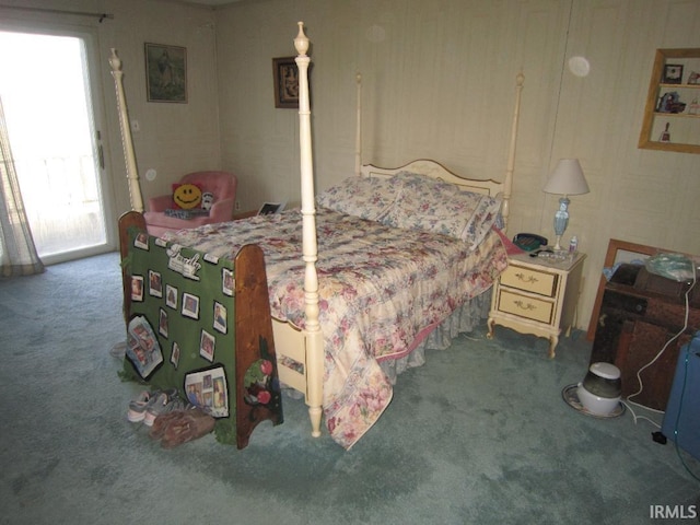 carpeted bedroom with access to exterior