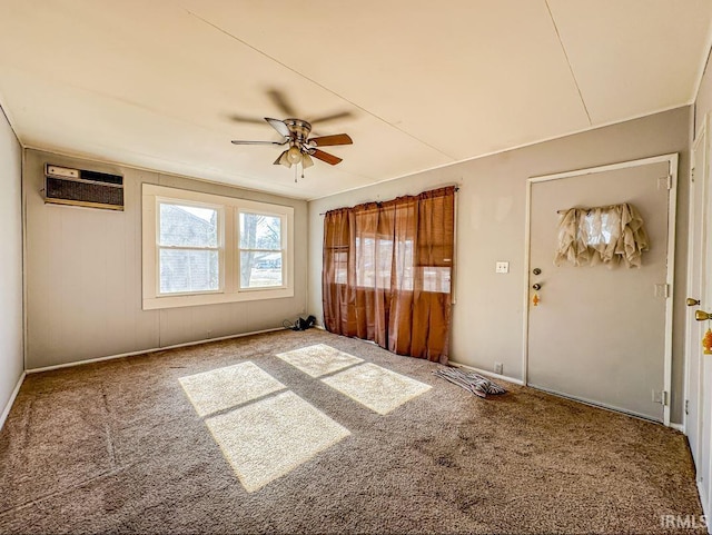 interior space with ceiling fan and a wall mounted AC