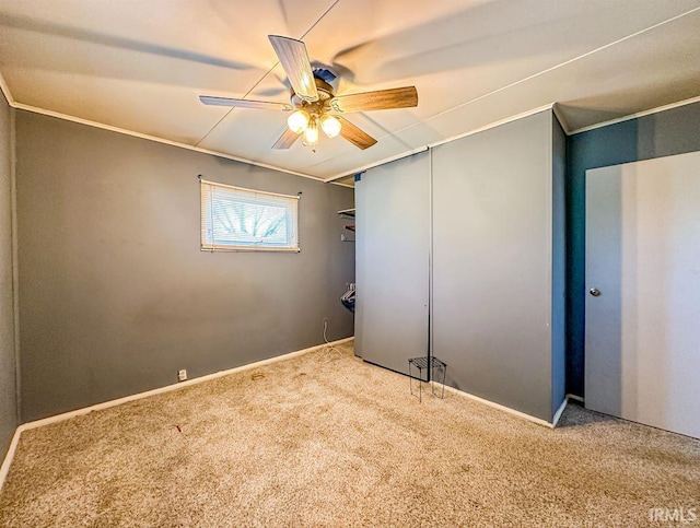 interior space featuring ceiling fan and ornamental molding