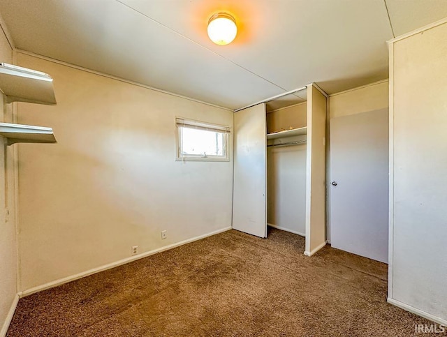 unfurnished bedroom with carpet floors and a closet