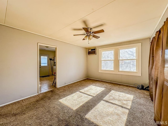 unfurnished room with ceiling fan, plenty of natural light, light colored carpet, and a wall mounted AC