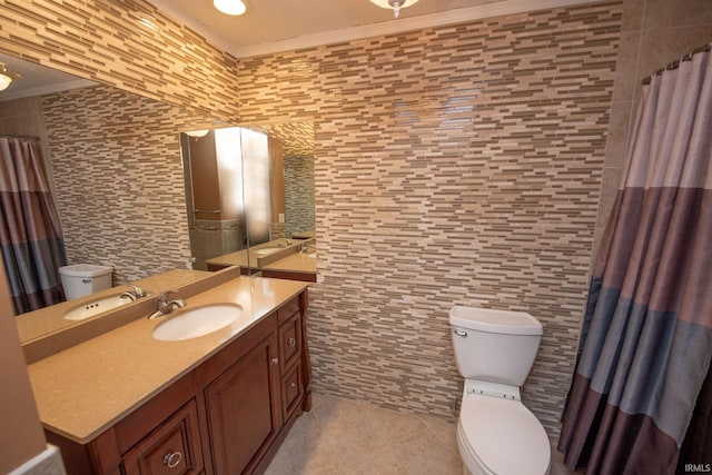 bathroom with tile walls, tile patterned flooring, vanity, ornamental molding, and toilet