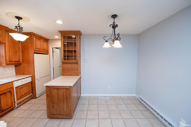 kitchen featuring paneled dishwasher, hanging light fixtures, a baseboard radiator, kitchen peninsula, and white fridge