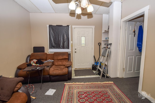 living room featuring dark carpet and ceiling fan