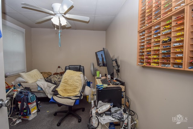 office area with ceiling fan and carpet flooring