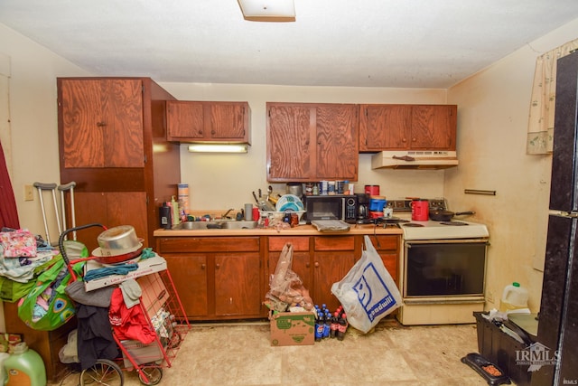 kitchen featuring sink and electric stove