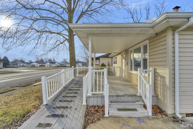 wooden terrace with a porch