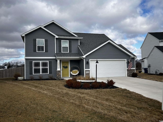 front facade featuring a garage and a front lawn