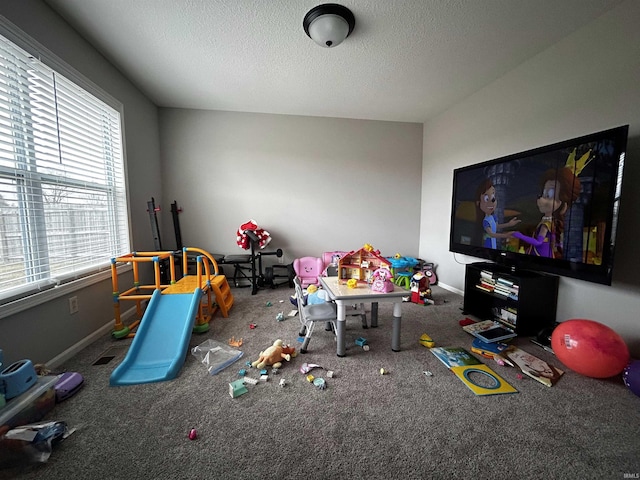 rec room with a textured ceiling