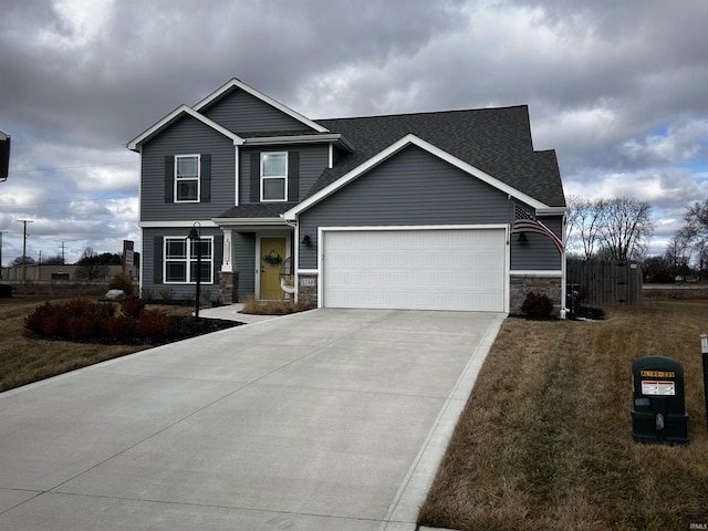 view of front facade featuring a garage and a front lawn