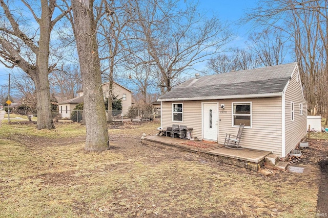 exterior space with a patio and a front yard