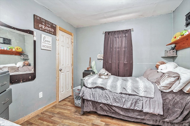 bedroom with light hardwood / wood-style floors