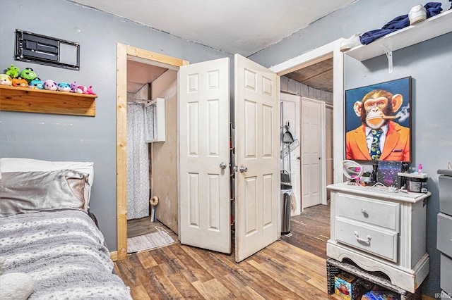 bedroom featuring wood-type flooring