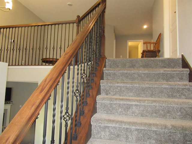 stairway with hardwood / wood-style flooring