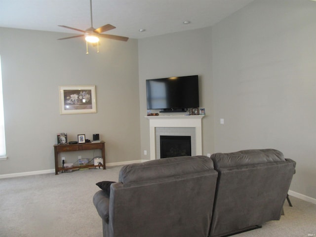 carpeted living room featuring ceiling fan