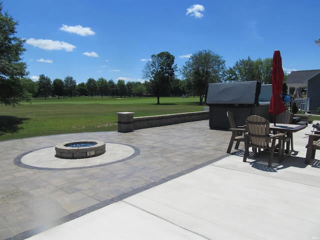 view of patio / terrace featuring a fire pit