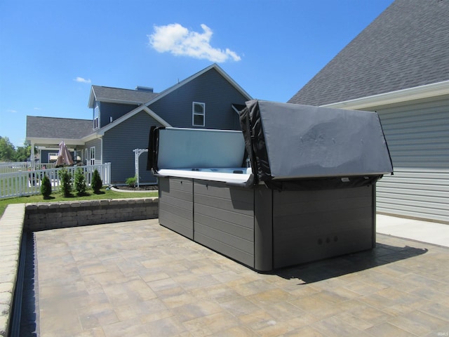 view of patio / terrace with a hot tub