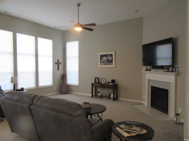 living room featuring ceiling fan and light colored carpet