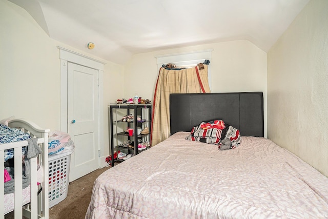 carpeted bedroom featuring vaulted ceiling