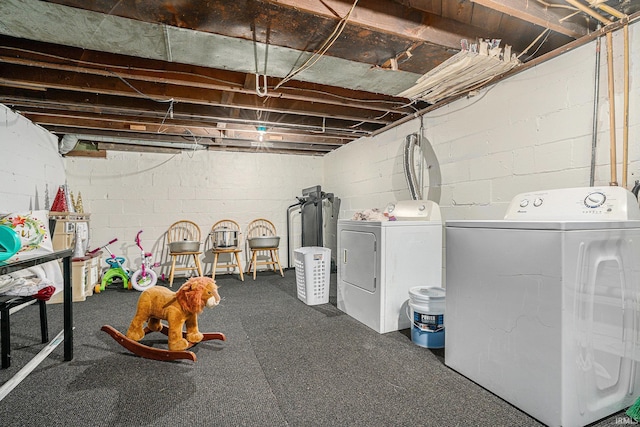 basement featuring washing machine and clothes dryer