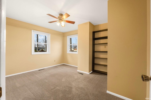 unfurnished bedroom with carpet floors and ceiling fan