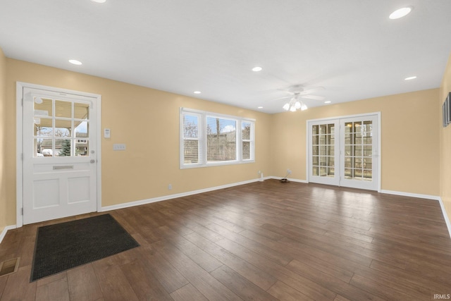 foyer featuring ceiling fan, dark hardwood / wood-style flooring, and french doors