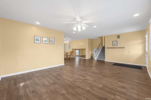 spare room with dark hardwood / wood-style flooring and ceiling fan