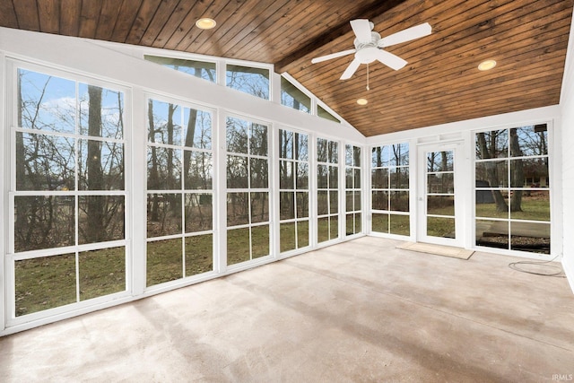 unfurnished sunroom with vaulted ceiling with beams, wooden ceiling, and a healthy amount of sunlight