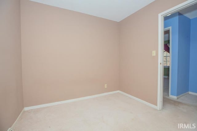 empty room featuring light colored carpet