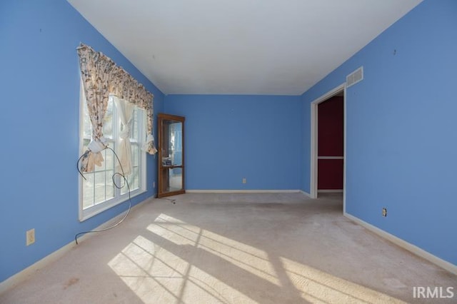 unfurnished room featuring carpet