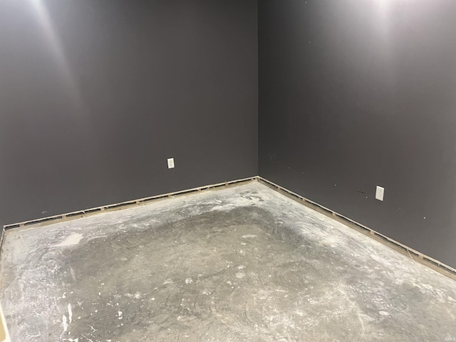 empty room featuring concrete flooring