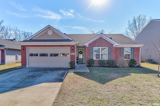 ranch-style home featuring a garage, a front yard, and central air condition unit