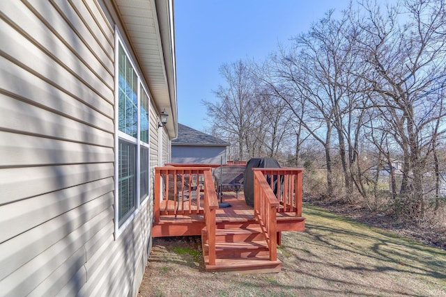 deck featuring a lawn