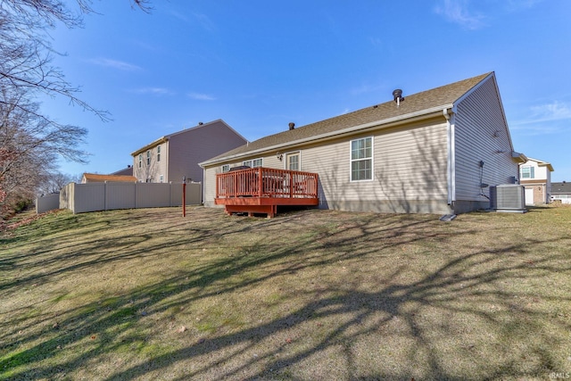 rear view of house with a deck, a lawn, and central air condition unit