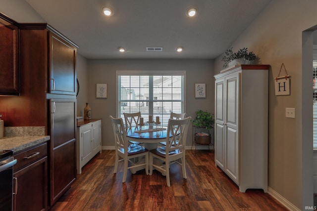 dining space featuring dark hardwood / wood-style floors