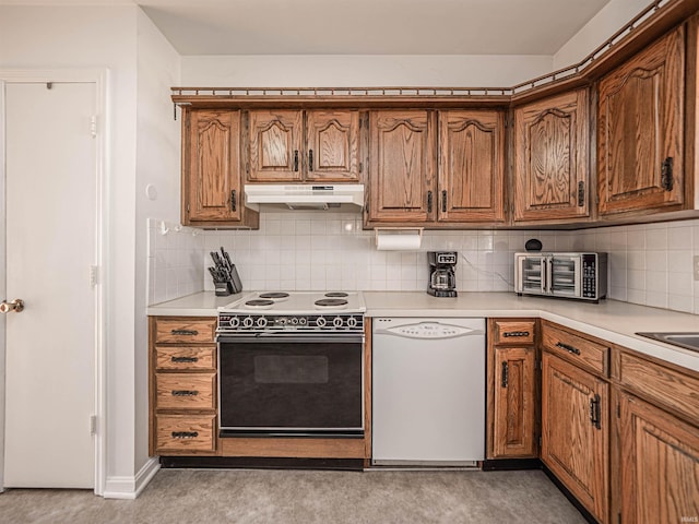 kitchen featuring tasteful backsplash, dishwasher, and black / electric stove