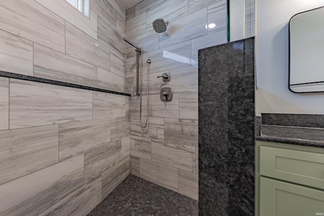 bathroom with a tile shower