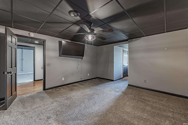 unfurnished room with ceiling fan, a paneled ceiling, and carpet