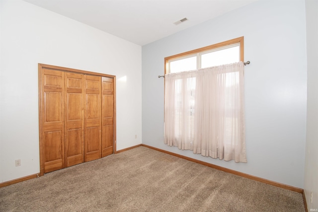 unfurnished bedroom with carpet flooring