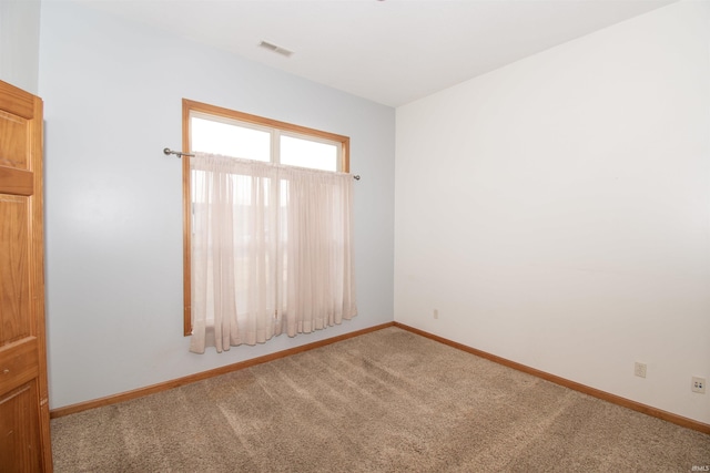 unfurnished room featuring carpet floors