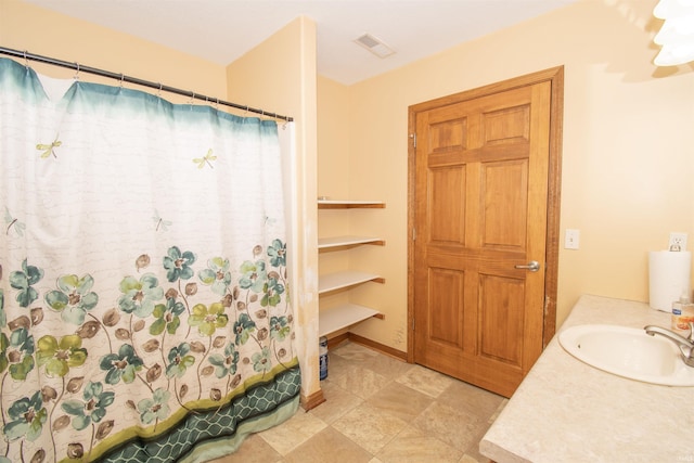 bathroom featuring vanity and shower / bath combination with curtain