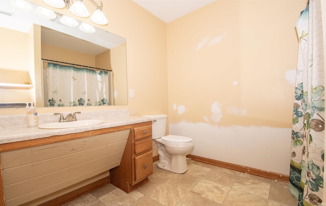 bathroom featuring vanity, a shower with shower curtain, and toilet