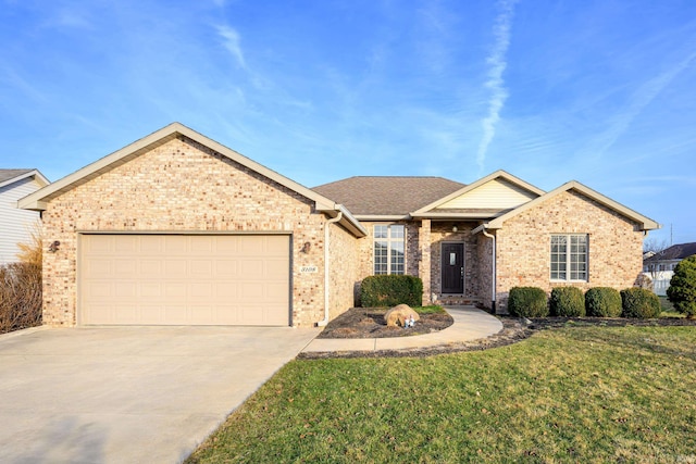 view of front of home with a garage and a front lawn