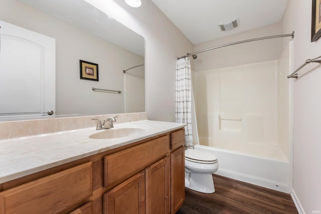 full bathroom with hardwood / wood-style flooring, vanity, toilet, and shower / bath combination with curtain