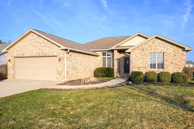 view of front of property featuring a garage and a front lawn