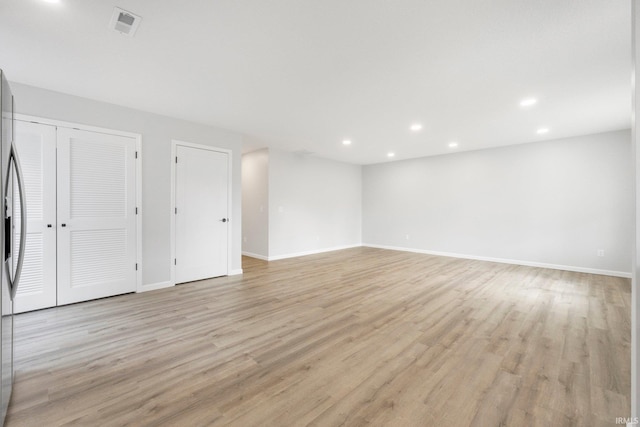 unfurnished room featuring light wood-type flooring